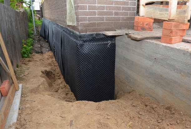 Happy homeowners after waterproofing job in North Canton